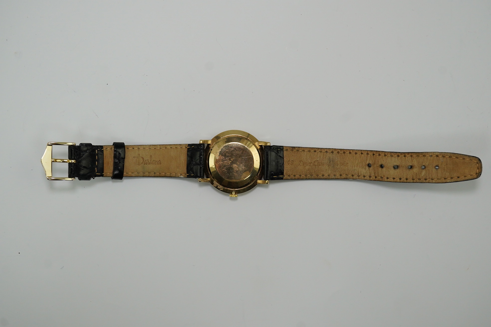 A gentleman's late 1950's 9ct gold Omega manual wind wrist watch